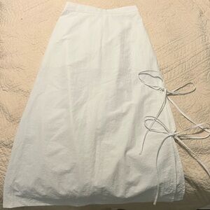 White maxi skirt with ties you can undo and has an extra layer underneath